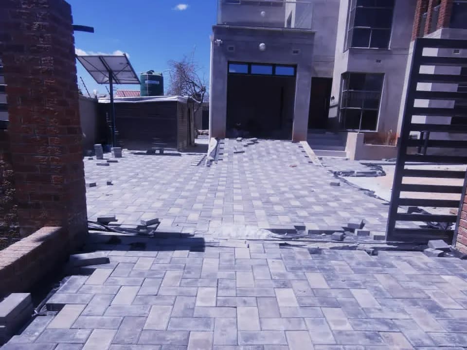 Courtyard and driveway at a double-storey house